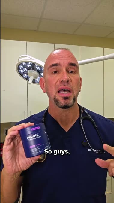 PetLab probiotic jar held by the vet presenter