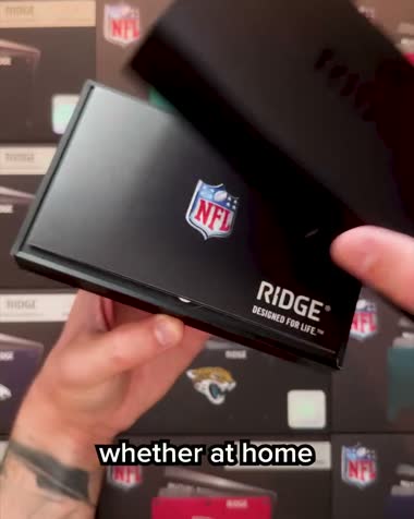 Ridge NFL wallet held to camera showing branding