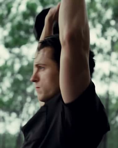 Tom Holland stretching in Vuori gear